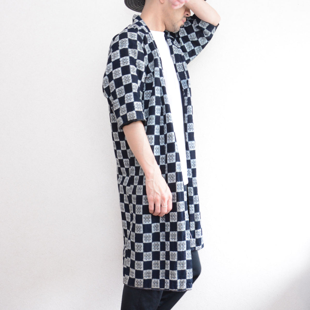 Indigo kasuri padded hanten on a 171 cm model showing the wide short sleeves