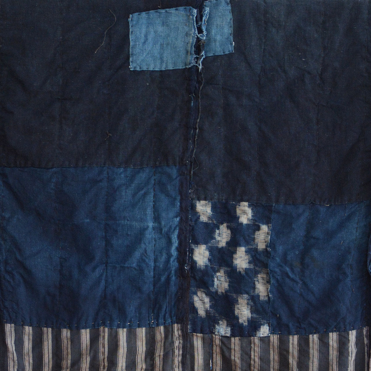 Traditional Japanese workwear reborn as wearable art through patchwork.