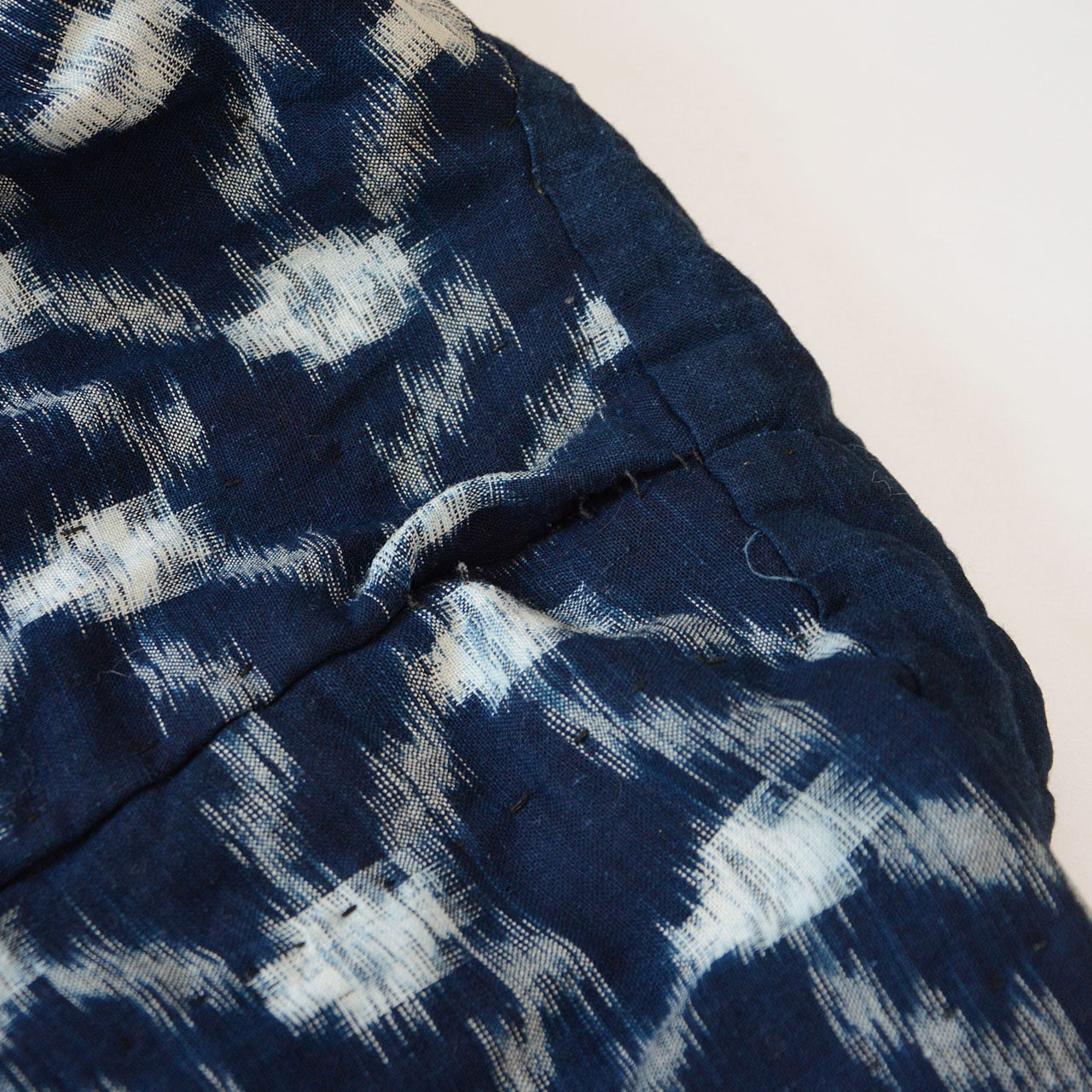 Double-sided Japanese indigo jacket showing unique crazy pattern design.