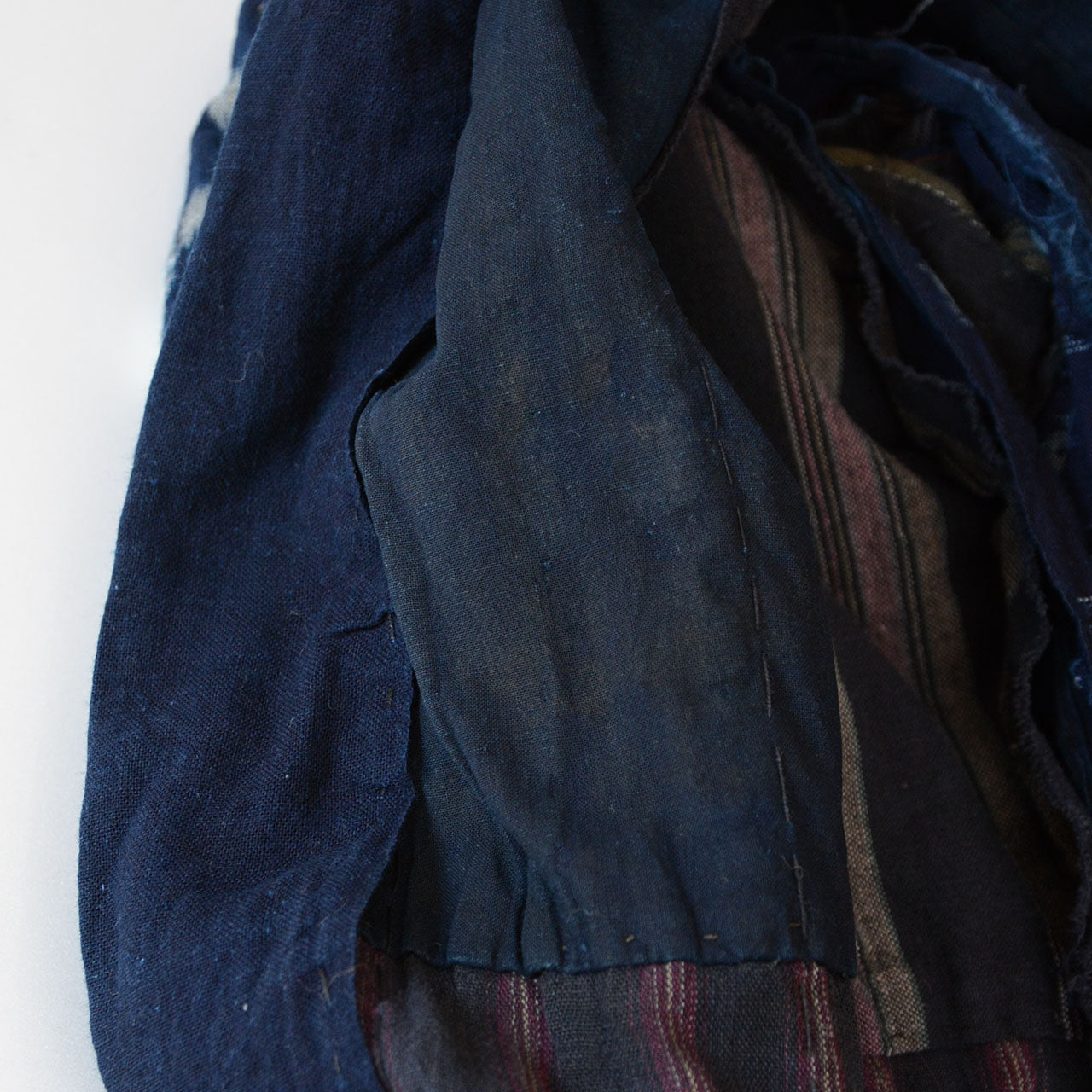 Noragi jacket layered with indigo, kasuri, and striped cotton fabrics.