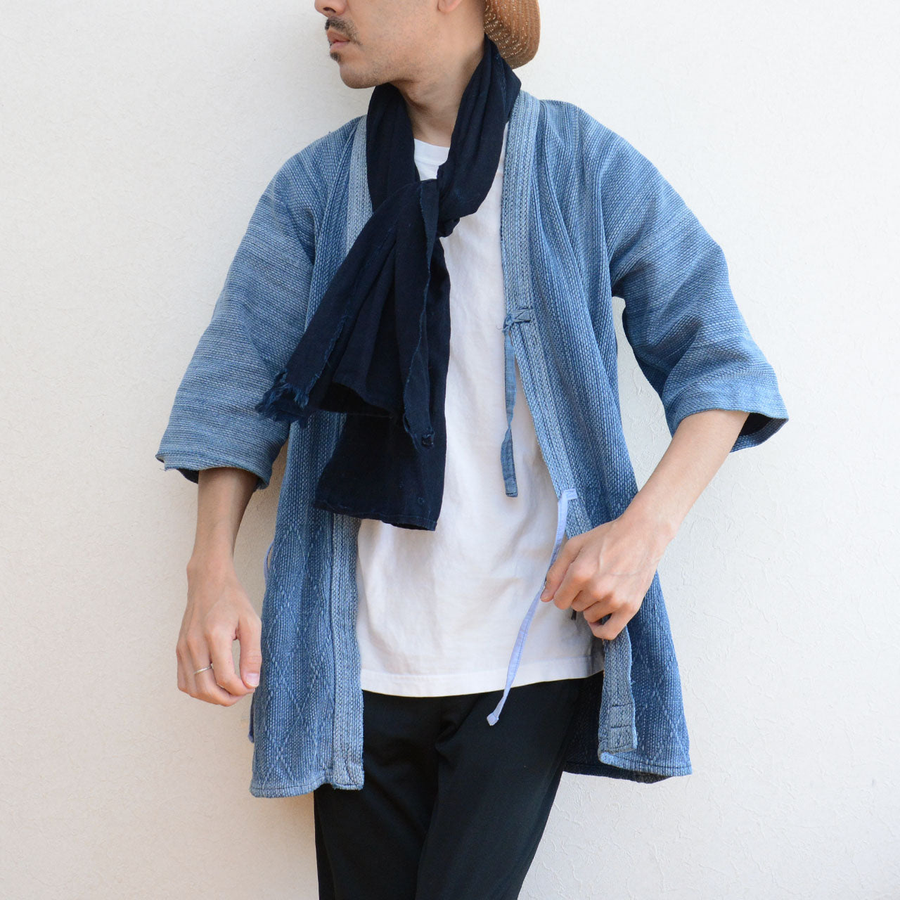 Vintage indigo garment with visible hand-stitched details