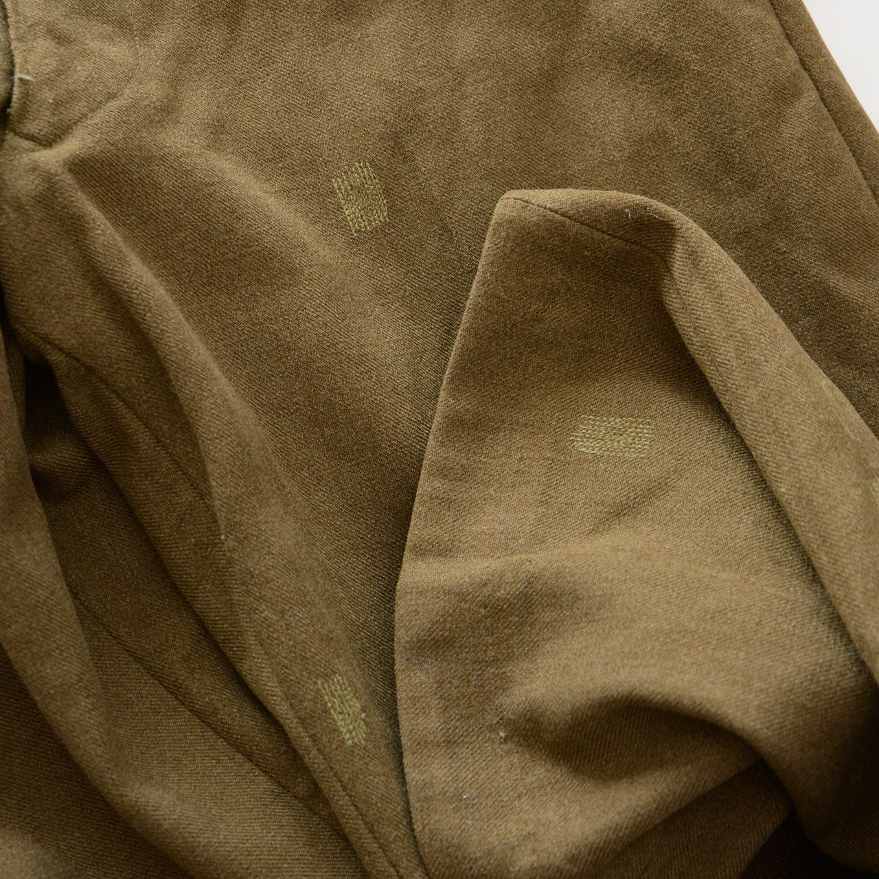 1940s-50s wool trousers with repaired seams, showcasing lived history