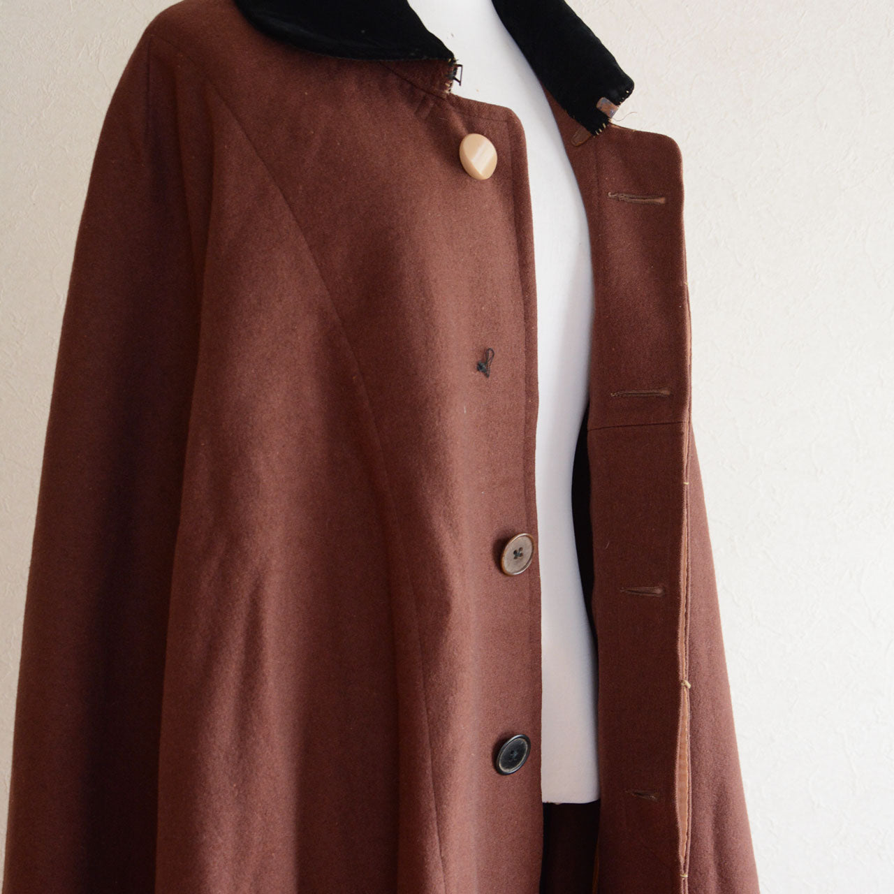 Japanese vintage outerwear with a classic cape form and timeless silhouette