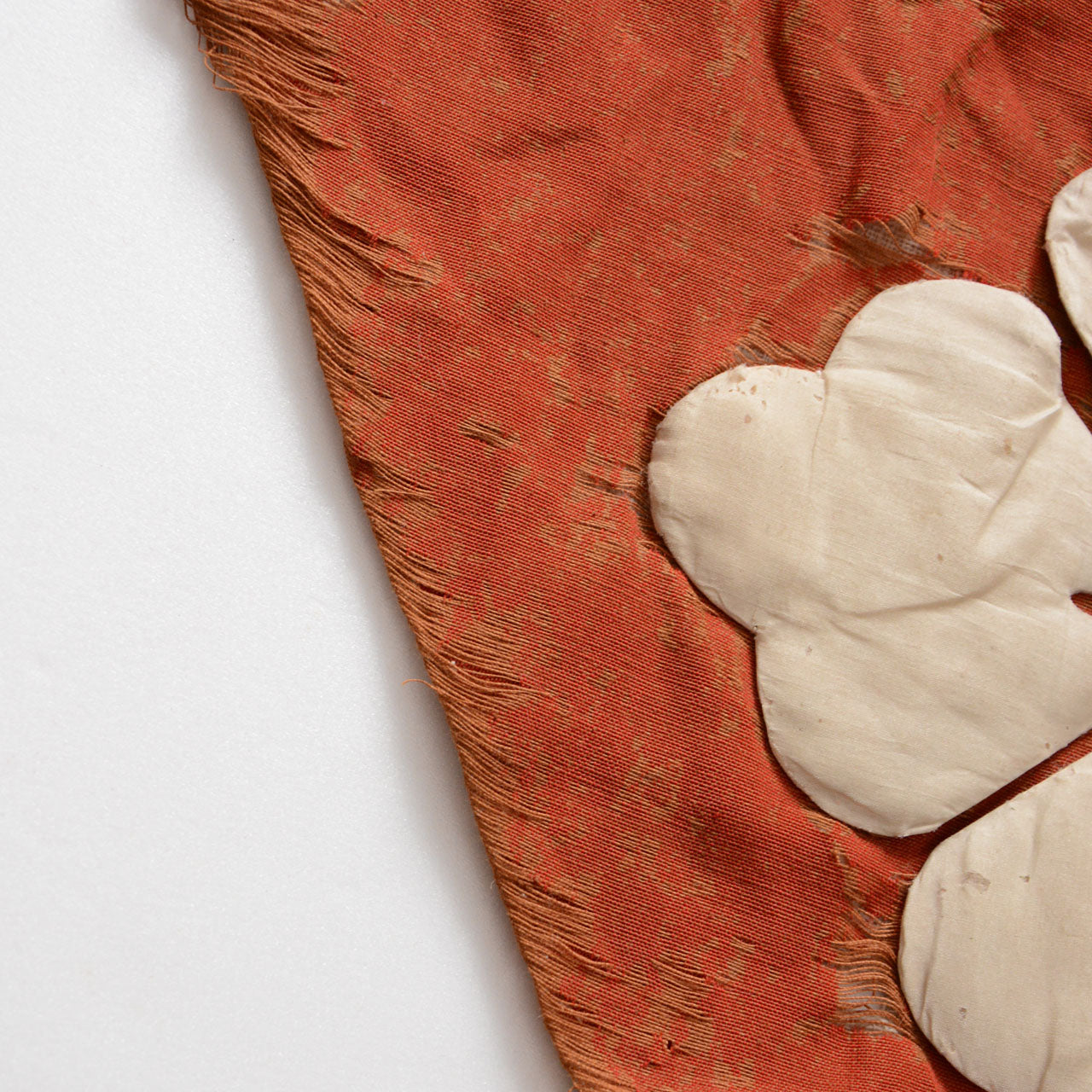 Weathered textile preserving 160 years of historical wear and texture.