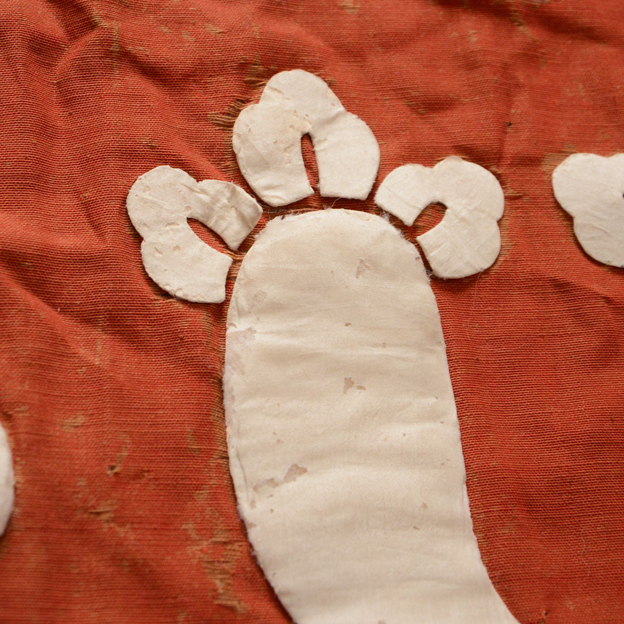 Vintage Japanese fabric artifact showcasing hand-stitched construction and fragile condition.