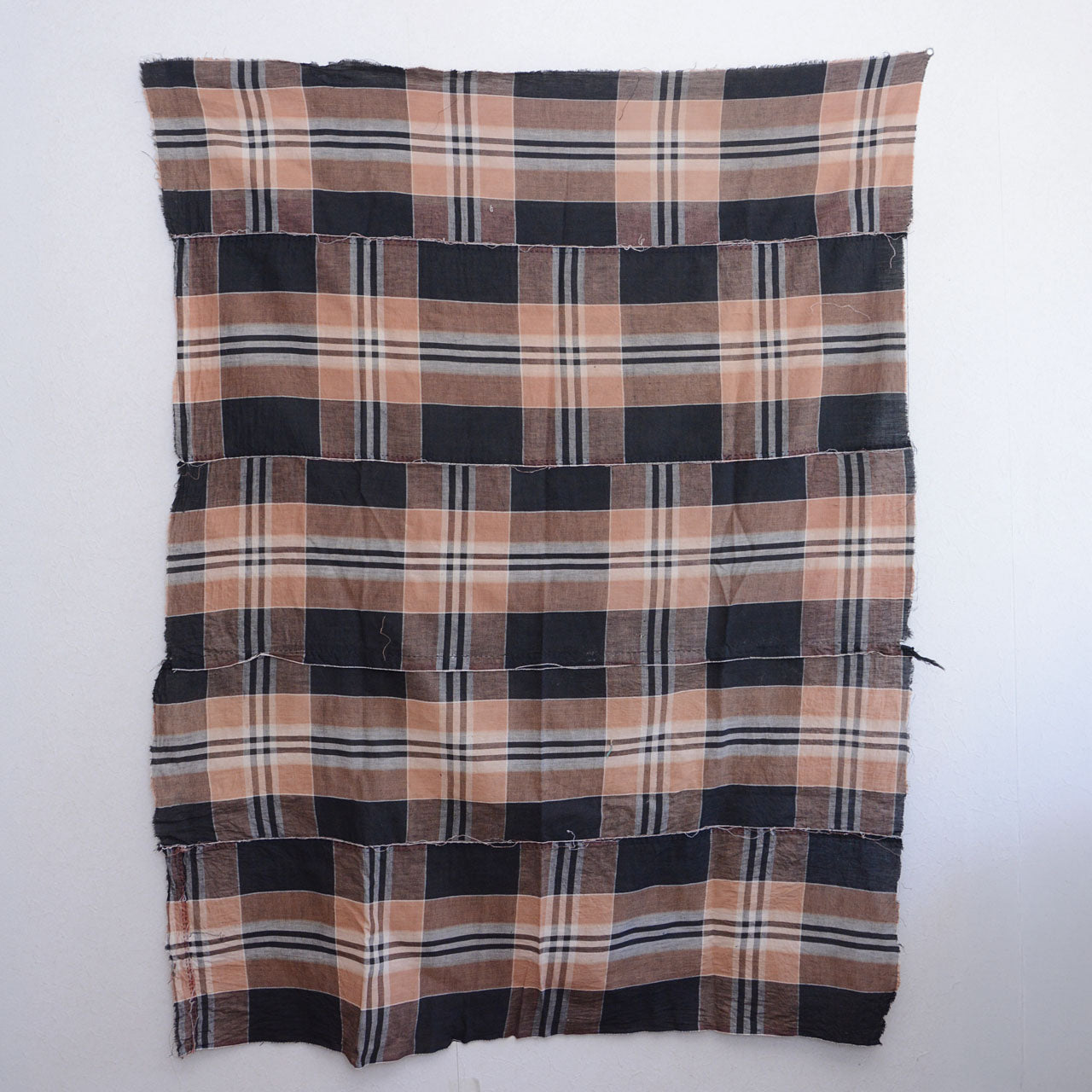 Vintage Japanese cotton check fabric, full view from back, black and camel plaid, Showa era futon toki
