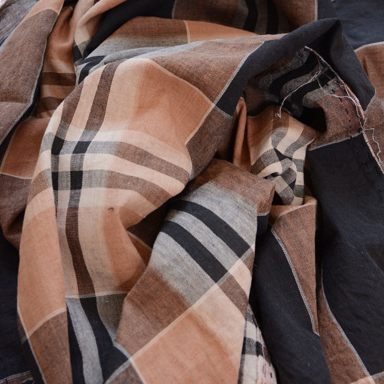 Vintage Japanese cotton check fabrics layered, black camel and beige plaid, showing depth and texture of Showa era textile