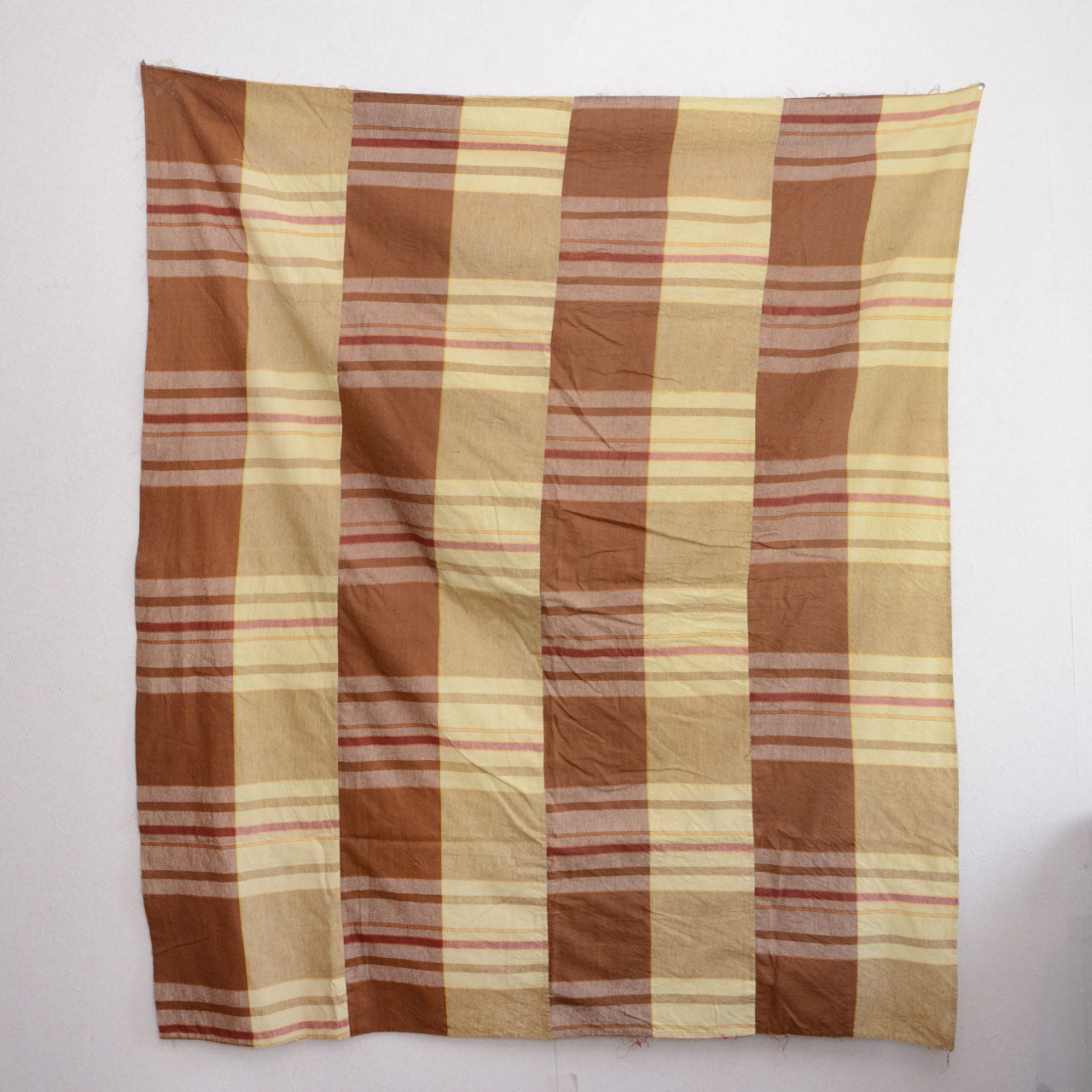 Full front view of vintage Japanese cotton fabric displayed on wall