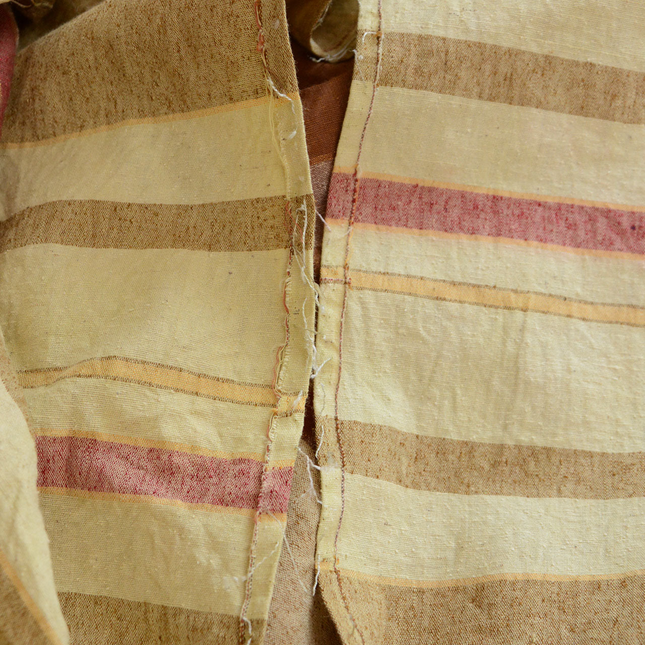 Frayed edge detail of vintage Japanese cotton fabric, unstitched by hand