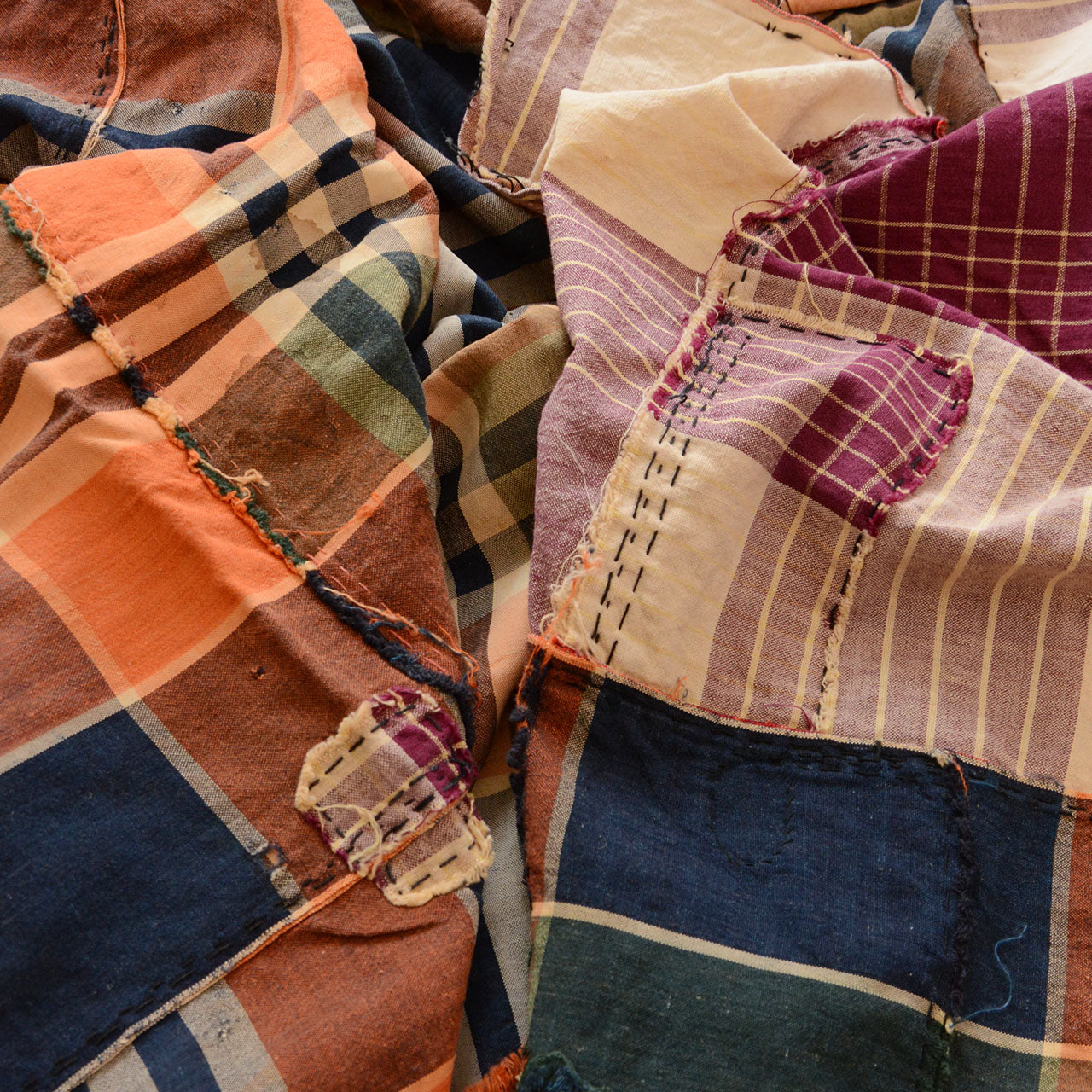 Vintage Japanese fabric with repairs and fading, wabi-sabi aesthetic