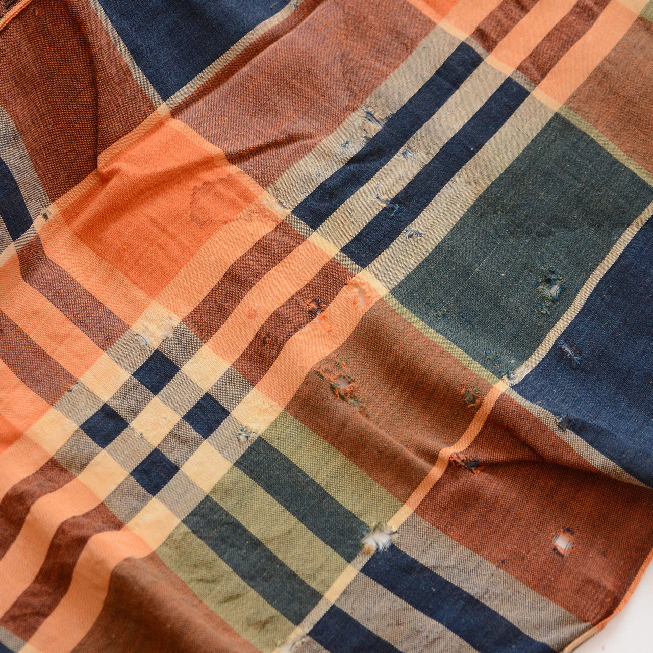 Hand-worn Japanese cotton fabric, traces of time and repair