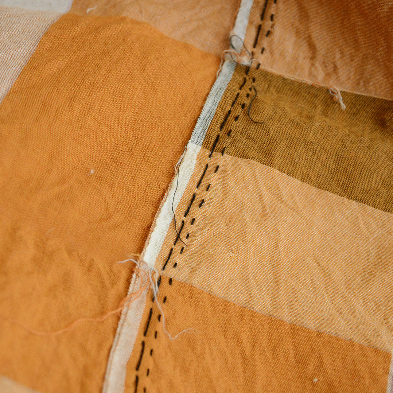 Soft, supple cotton with hand-stitched traces