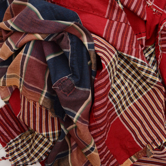 Vintage Japanese cotton futon cover in crazy pattern — two contrasting plaid fabrics sewn together, red-ground check and navy-ground check, mid-Showa era
