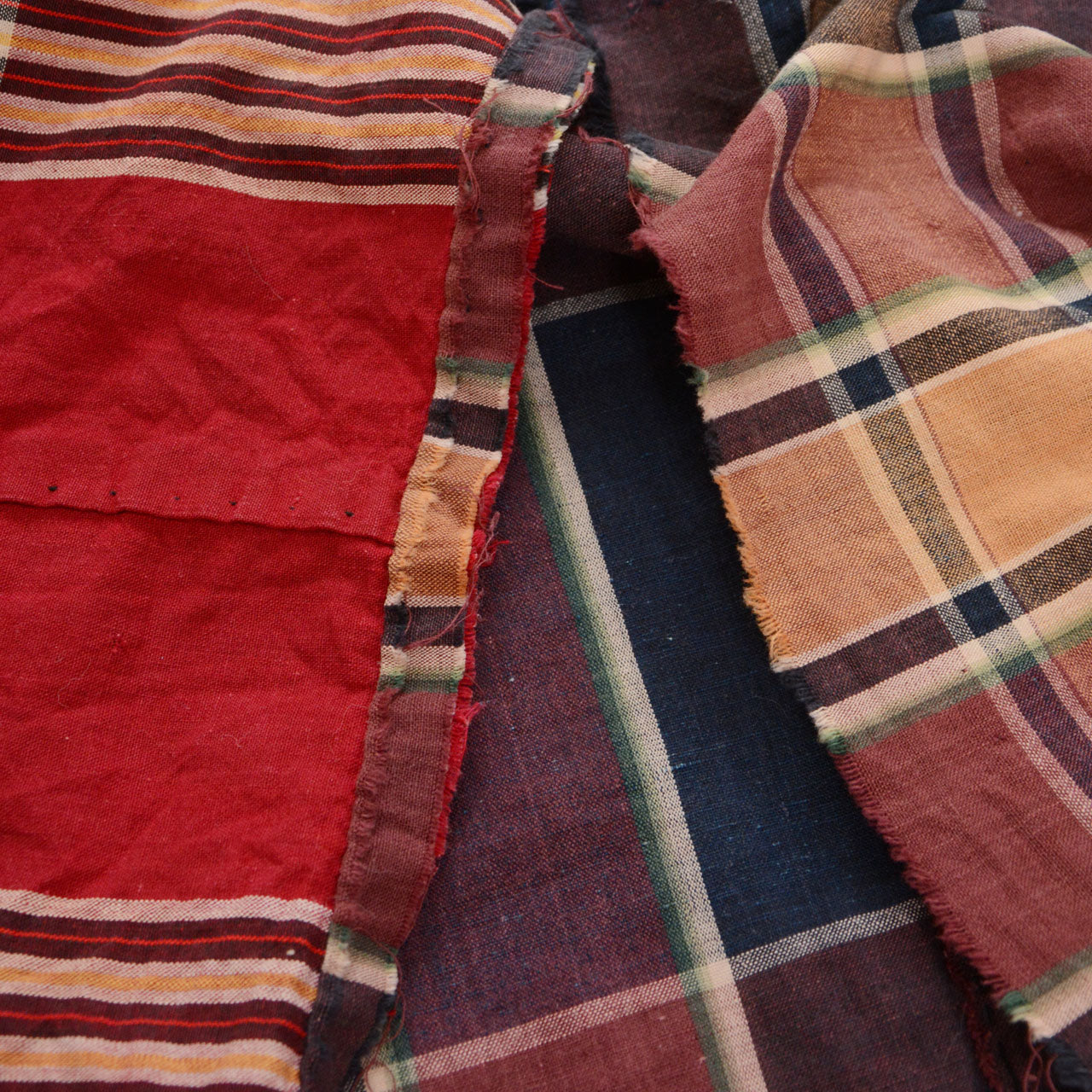 Raw unfinished edge of vintage Japanese futon cover — frayed cotton selvage, characteristic of antique Japanese fabric
