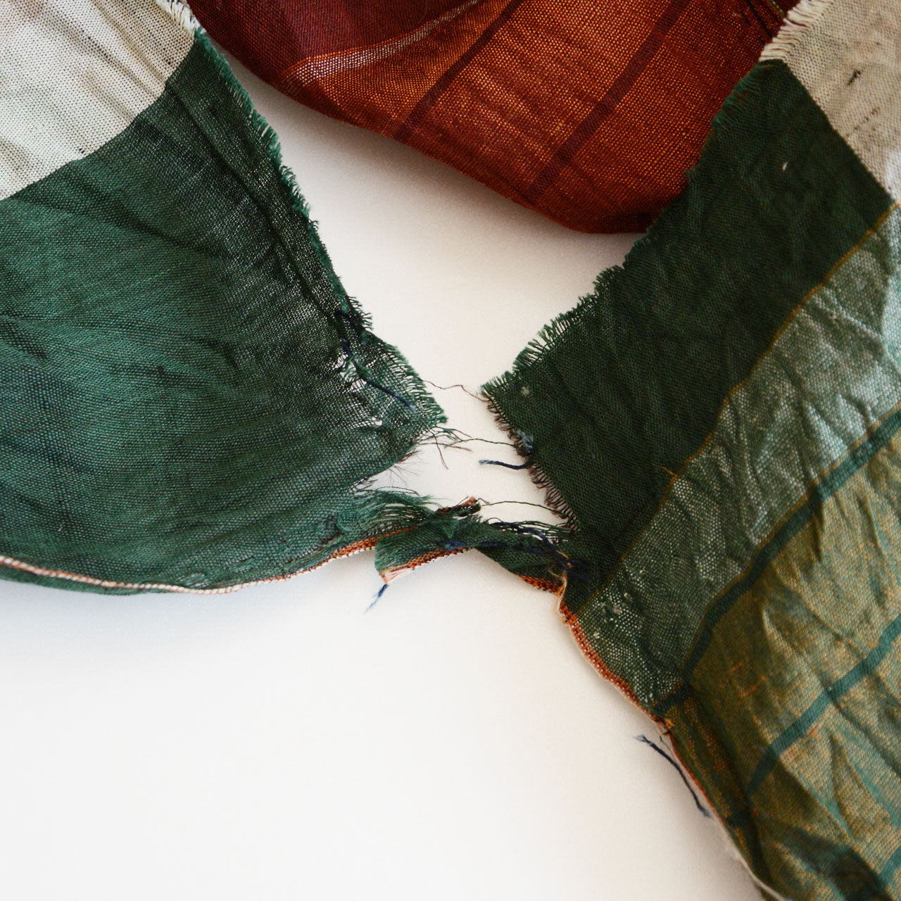Worn vintage Japanese cotton cloth with natural fading and repair marks