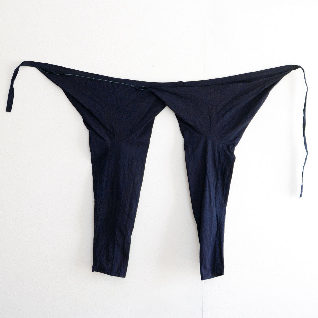 Vintage Japanese indigo cotton momohiki work pants from mid-Showa era
