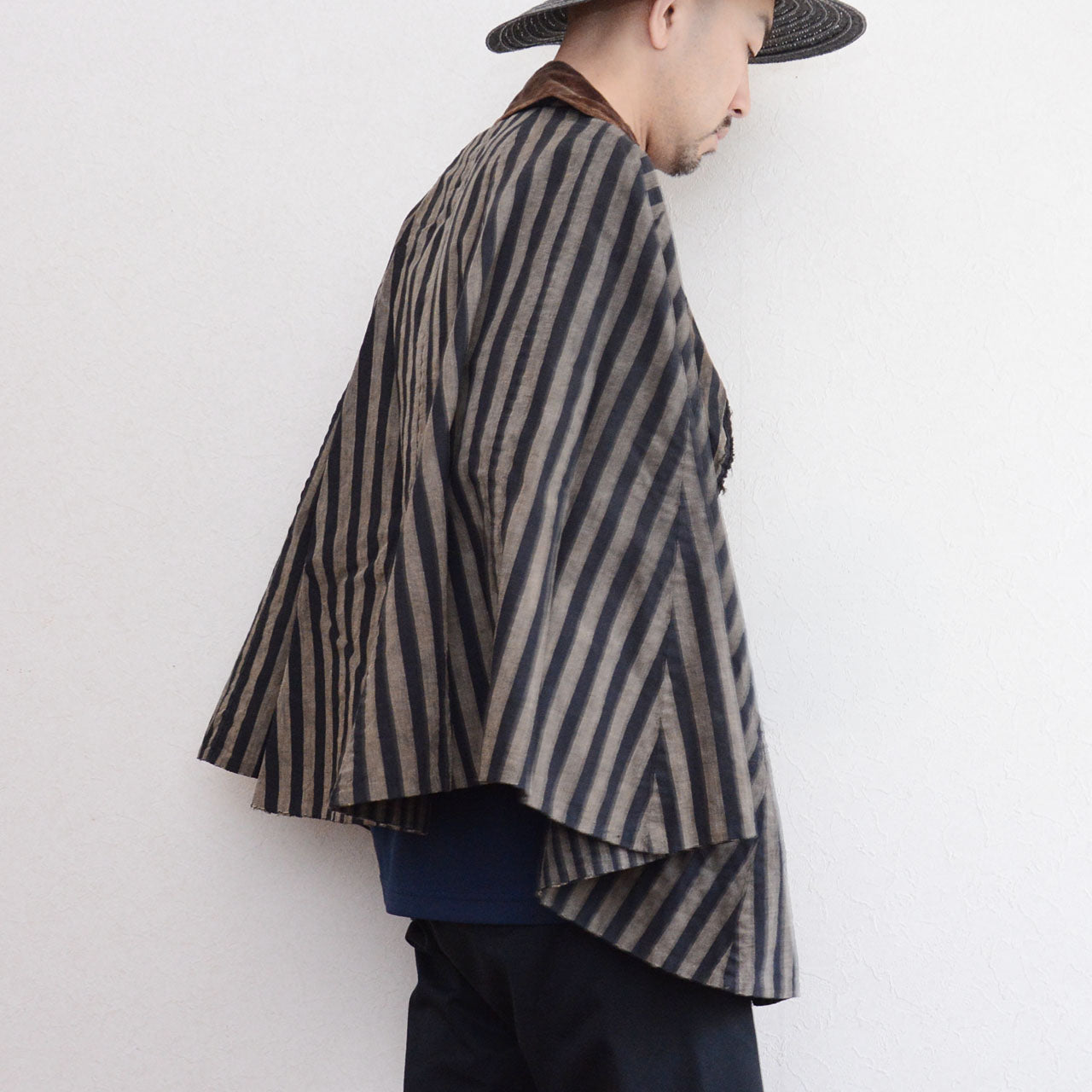 Japanese dochu-kappa travel cape, vertical stripe cotton, full-circle silhouette, styled on model, side view