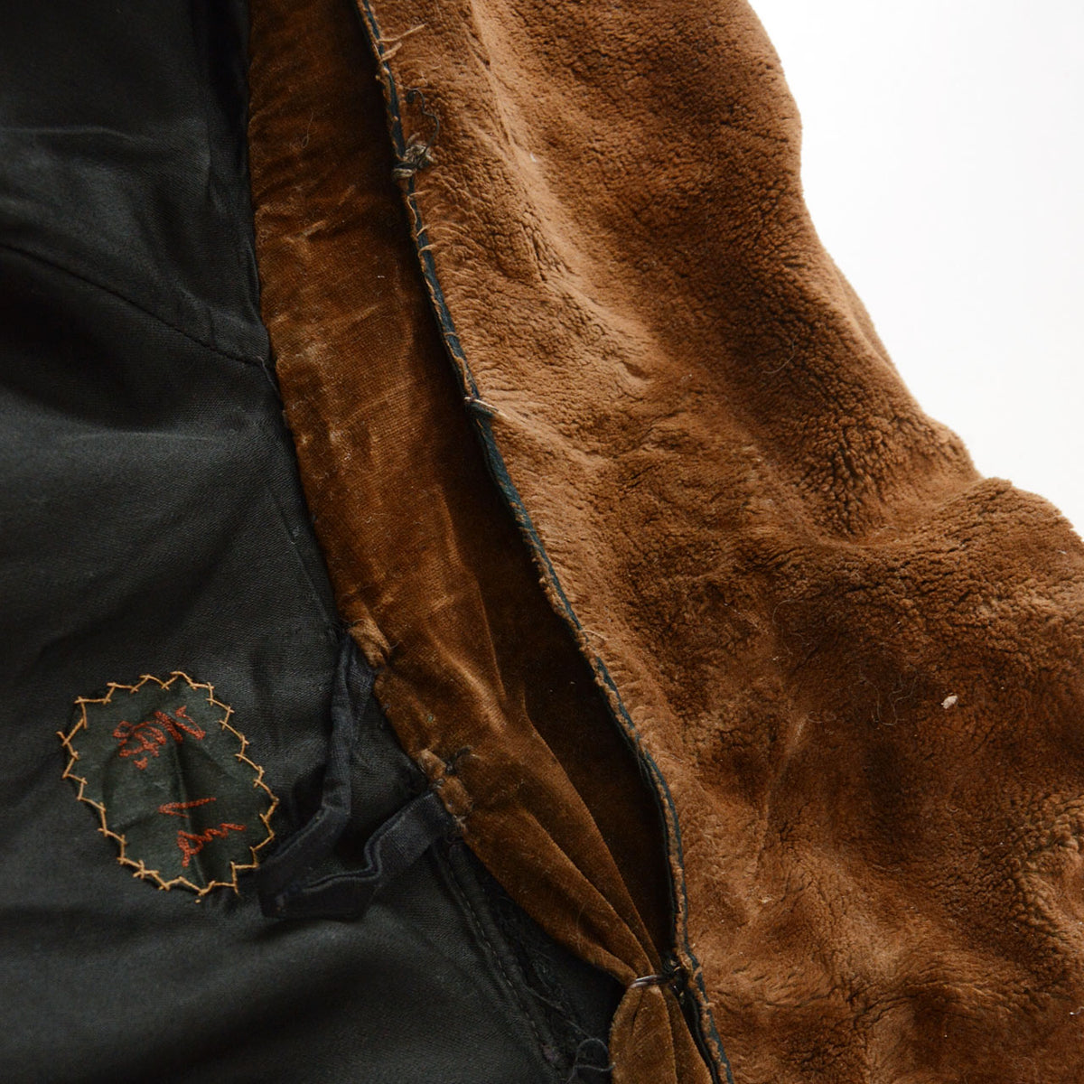 Later-added brown fur collar lifted to reveal the original black velvet collar on a Bankara mantle.
