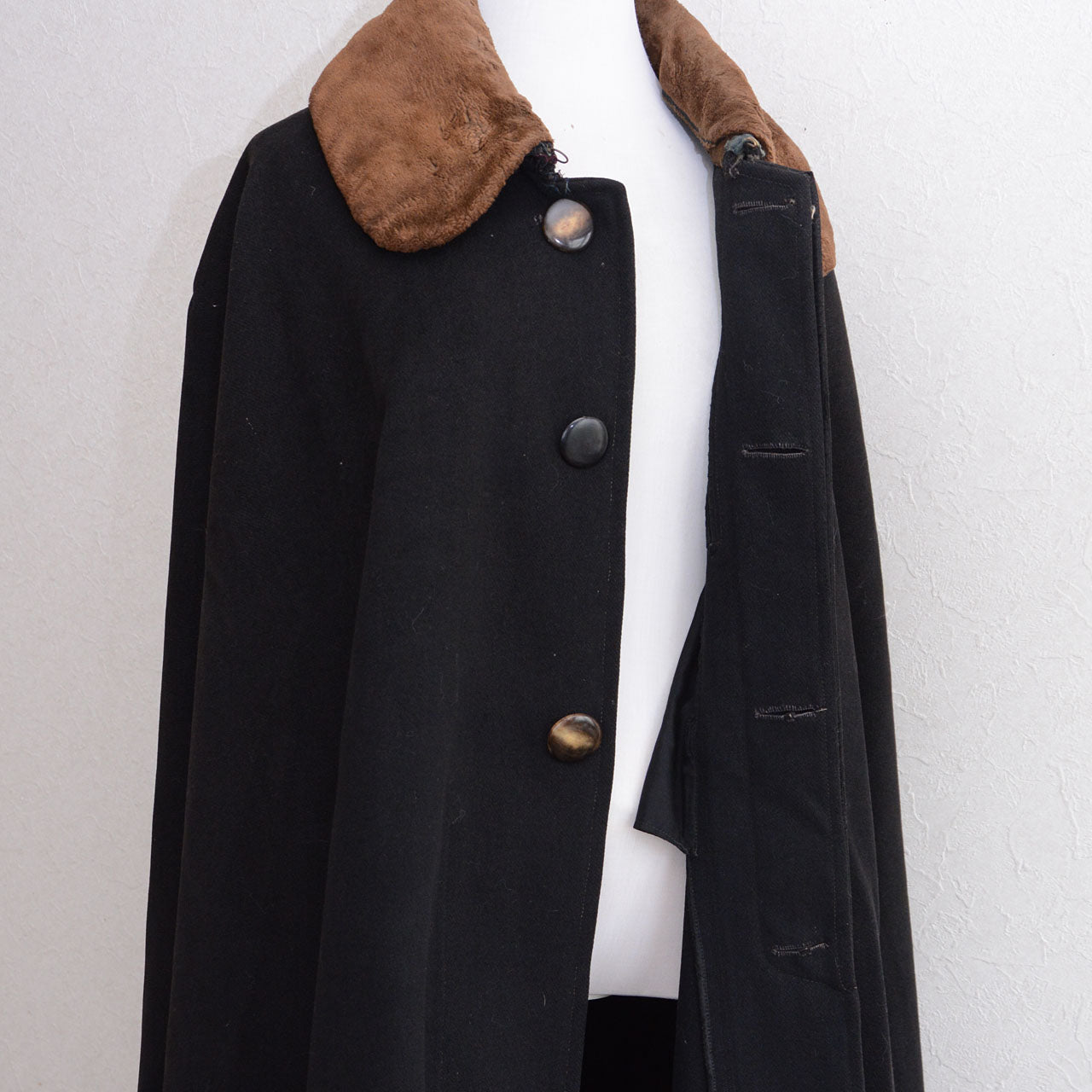 Black wool Bankara mantle with mismatched replacement front buttons and a missing bottom button.