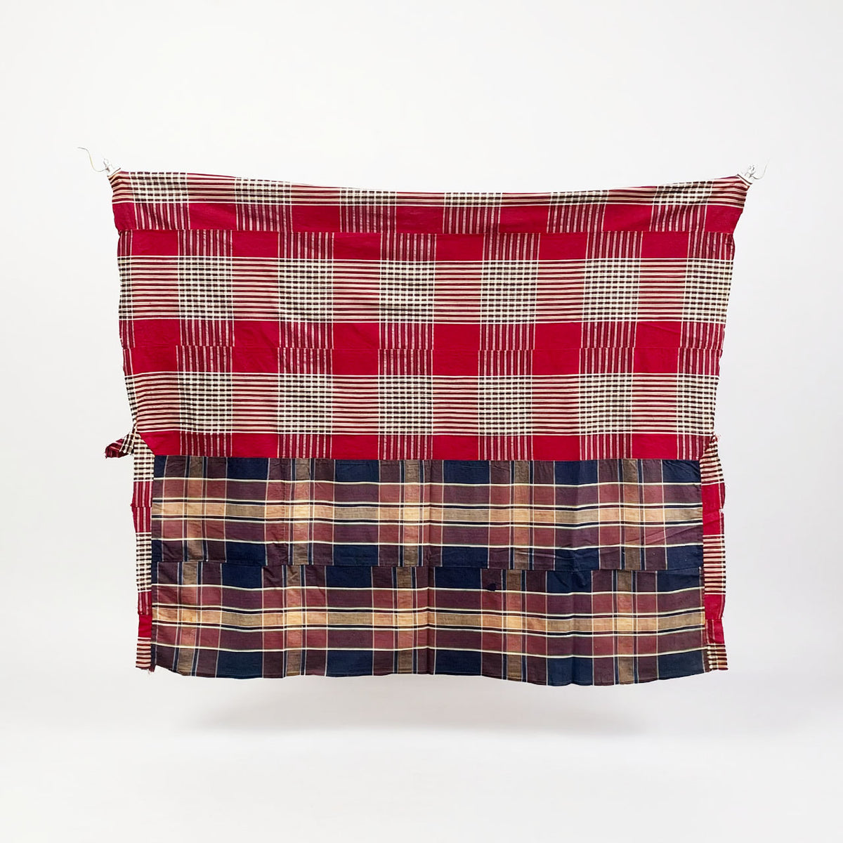 Red and dark indigo checkered Japanese vintage cotton cloth with joined sections and frayed edges