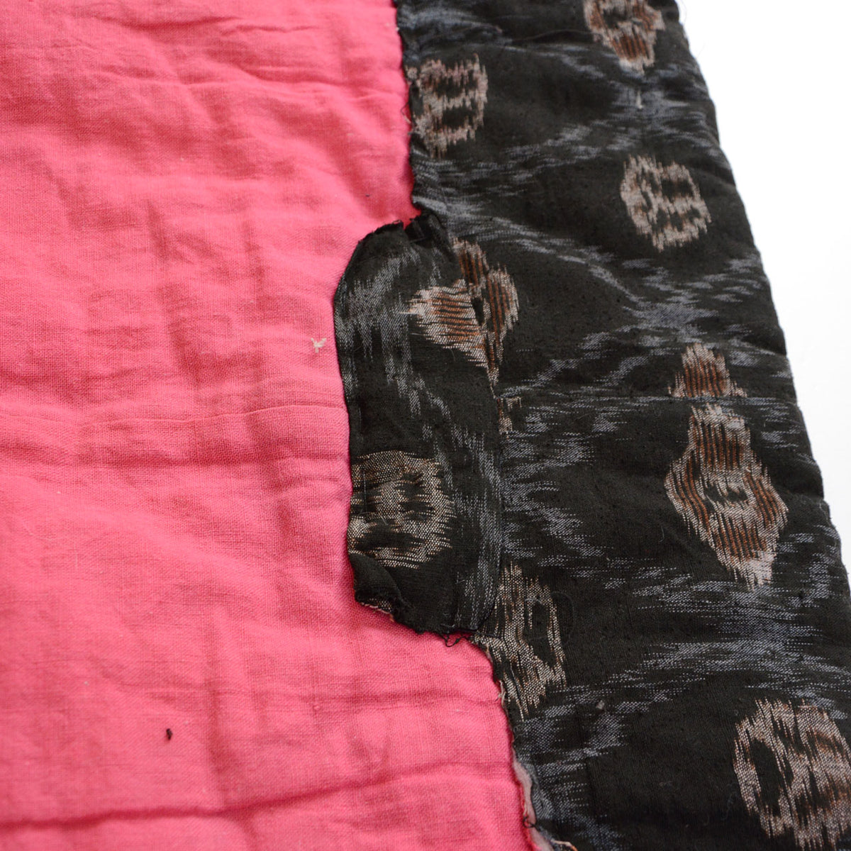 Frayed fabric edges and open join in Japanese vintage padded cotton textile