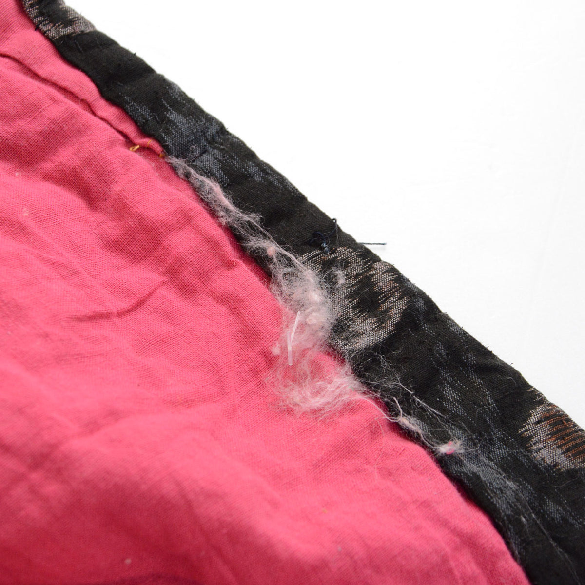 Exposed padding along an open seam in Japanese vintage cotton textile