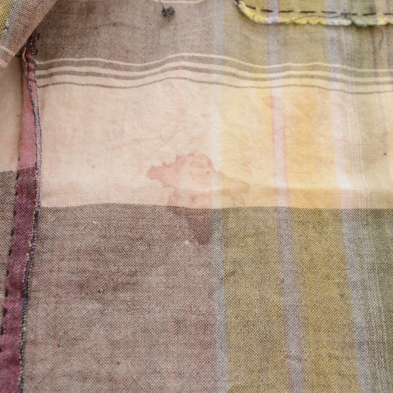 Japanese vintage cotton plaid fabric, staining and fading detail, Showa era boro textile