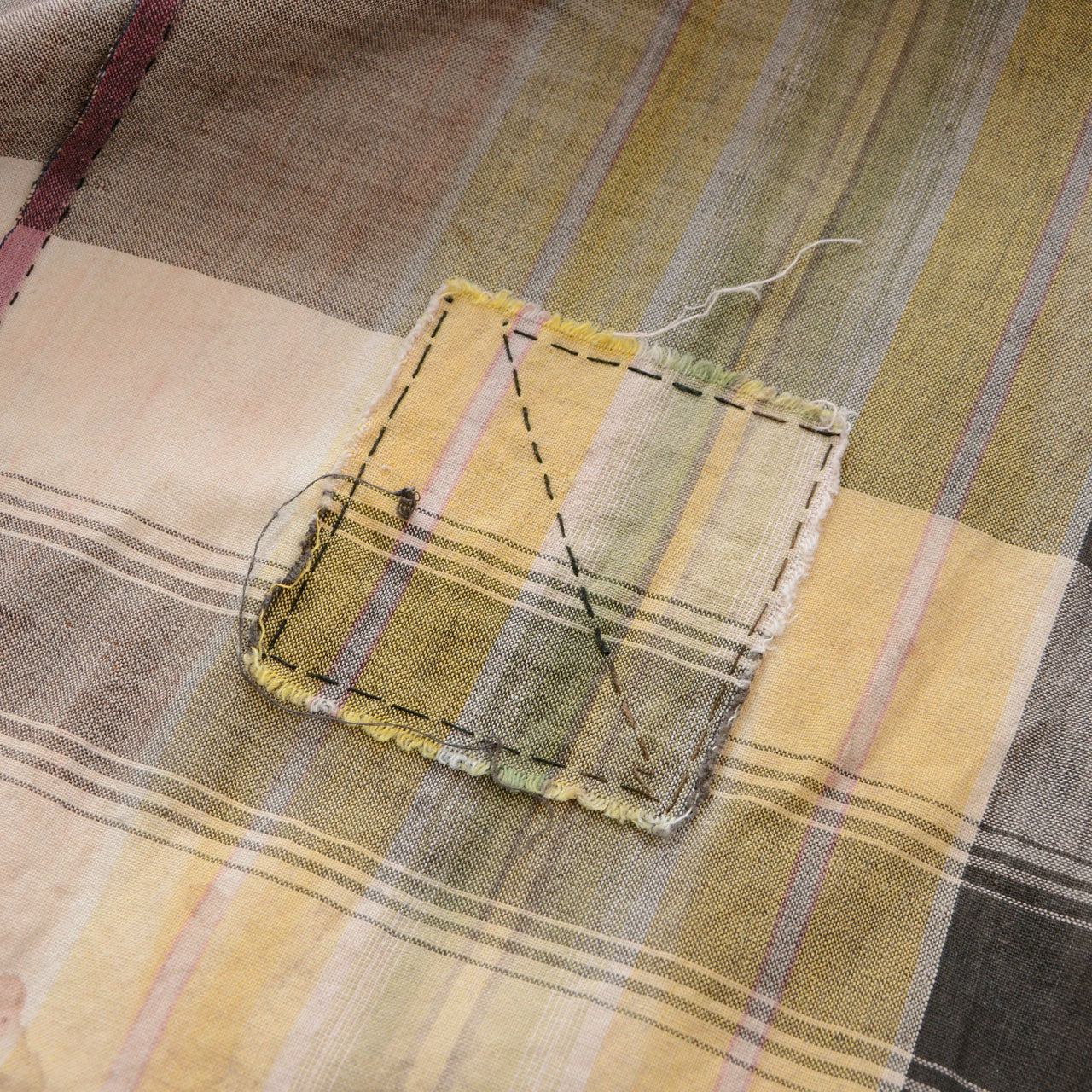 Japanese vintage cotton plaid fabric, hand-sewn boro patch detail, running stitch repair, Showa era