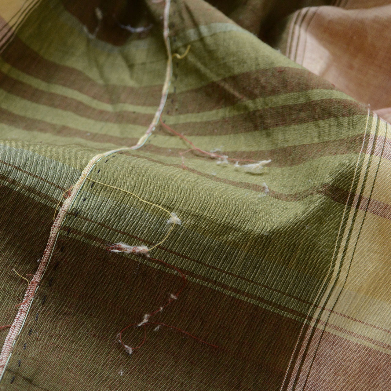 Japanese vintage cotton fabric, multicolor plaid in rust red, cream, and mauve, unstitched Showa-era futon textile, soft drape with aged cotton texture