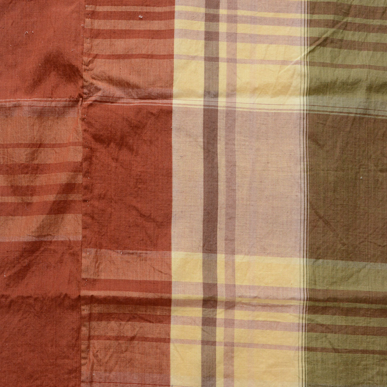 Japanese vintage cotton fabric, rust red, cream, and olive green plaid, Showa era, close-up of weave texture and color detail