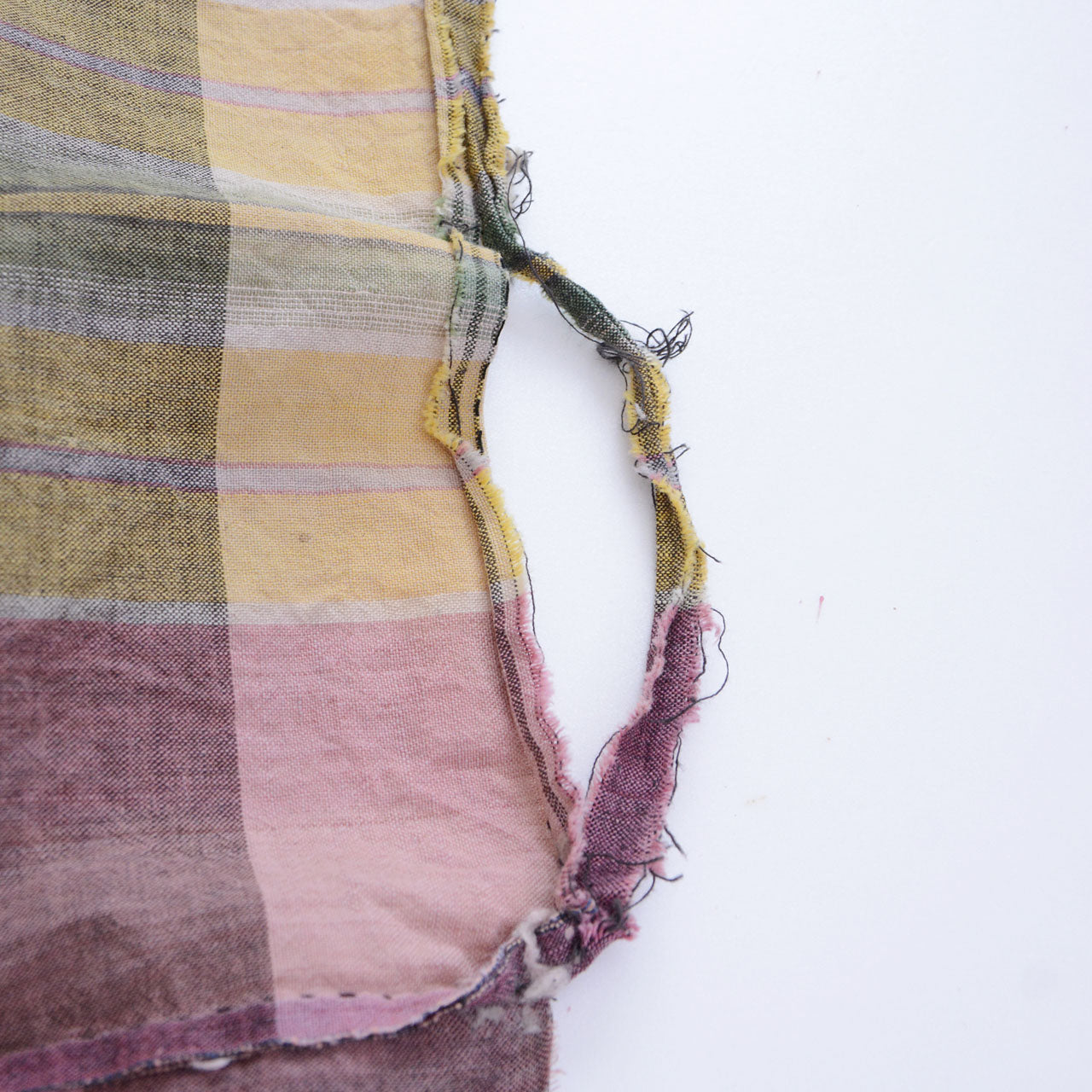 Frayed edge of vintage Japanese cotton fabric — raw, unstitched border with a quiet beauty of its own