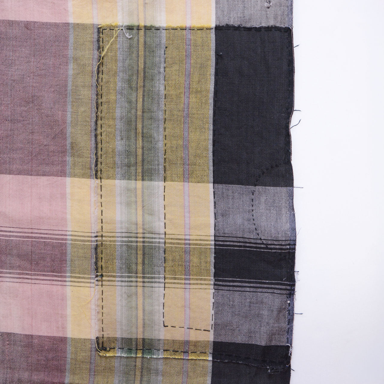 Artistic hand-stitching on boro repair section — meticulous mending that transforms damage into textile art