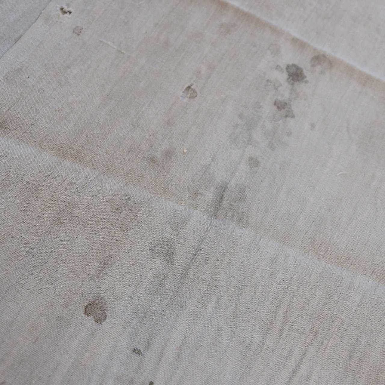 Aged Japanese cotton fabric pieces showing woven texture and natural color variation