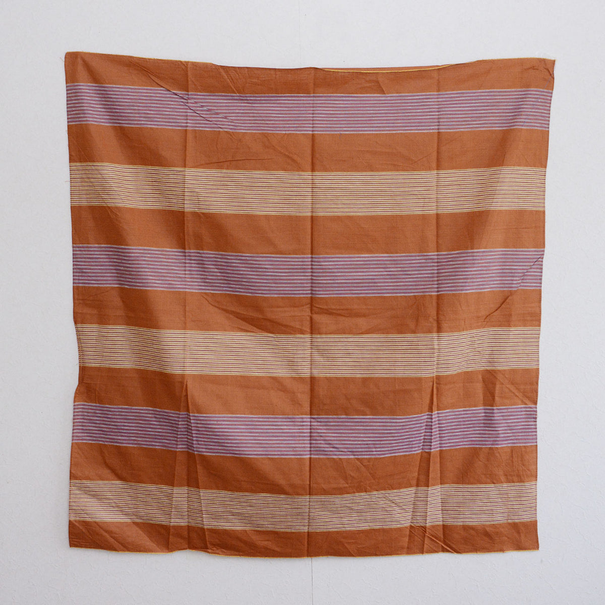 Brown cotton furoshiki with alternating bands of pale and purplish fine stripes