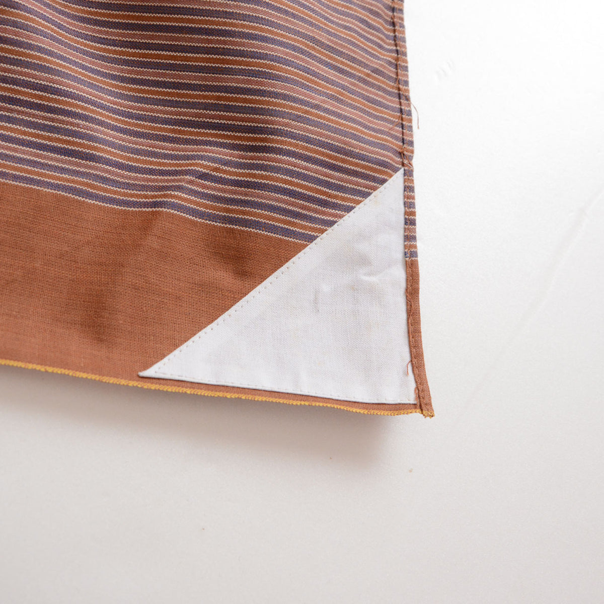 Reverse corner of Japanese cotton furoshiki with a white cloth panel for writing a name or address