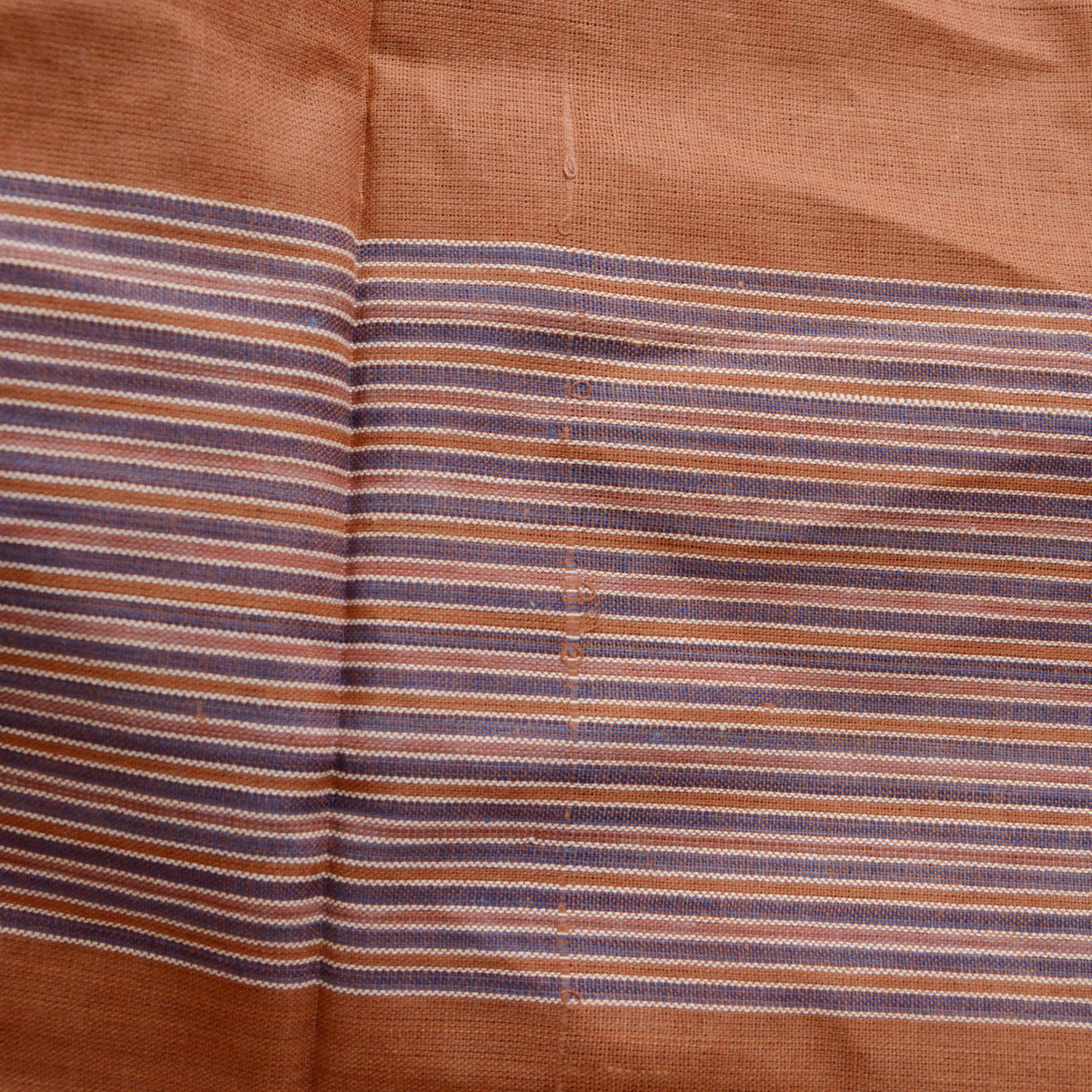 Striped cotton furoshiki showing fabric slippage along the brown and purple striped area