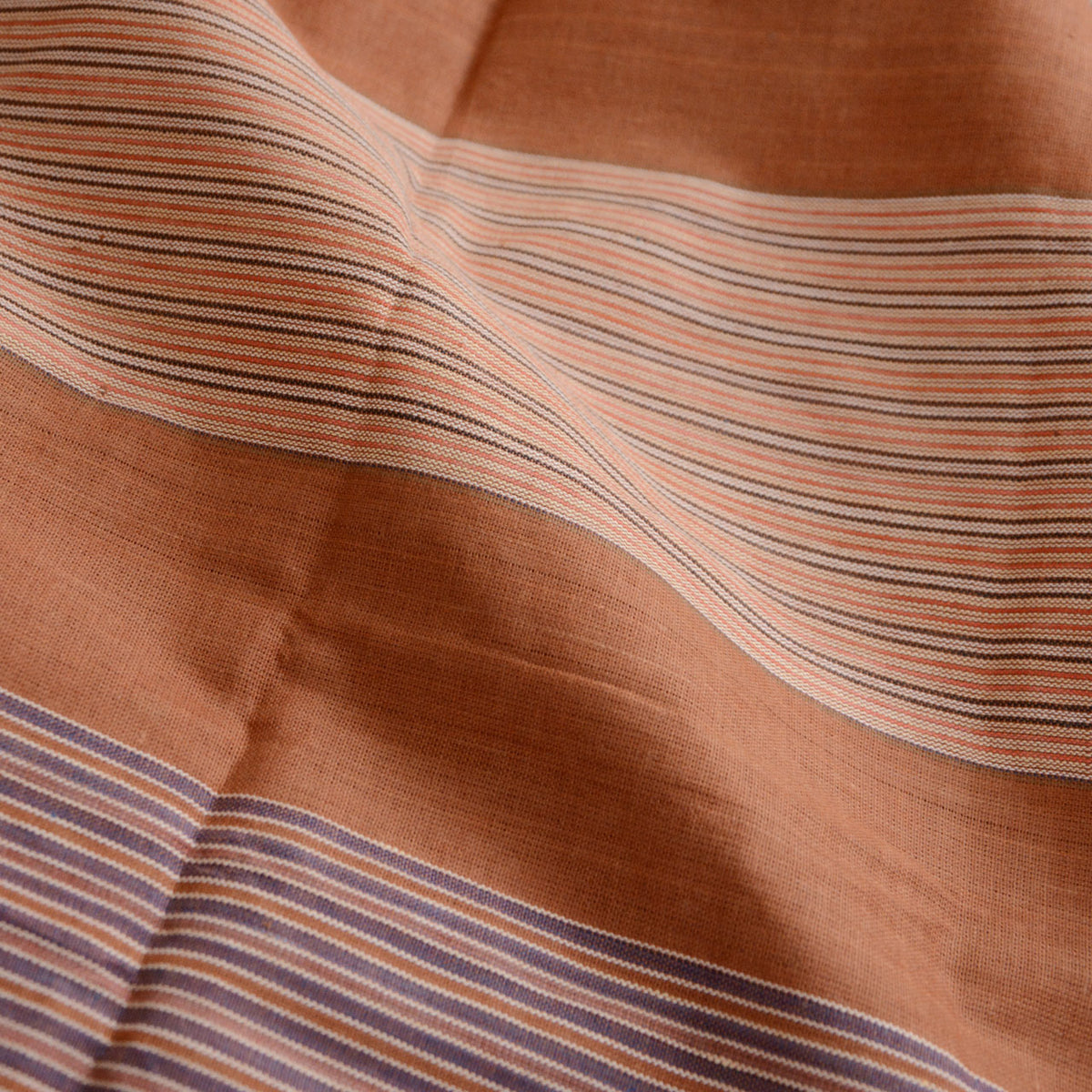 Japanese vintage cotton furoshiki with fine red, cream and muted purple stripes against a brown ground