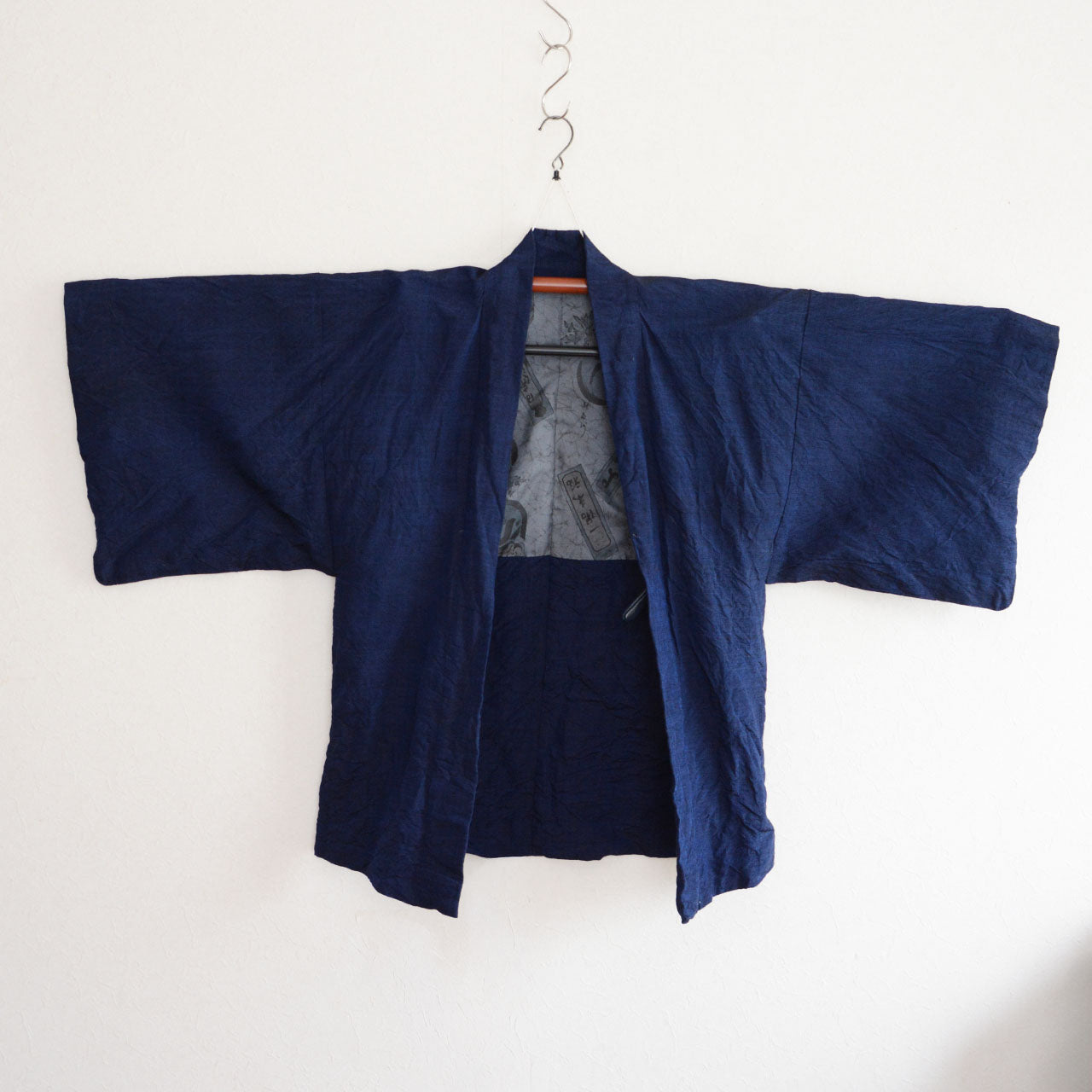 Men’s Japanese haori jacket with Daruma motif lining reflecting cultural symbolism