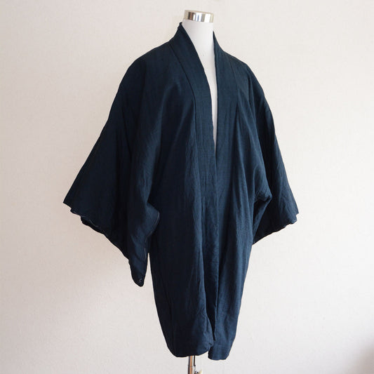 A Japanese vintage haori jacket with dragon patterned fabric