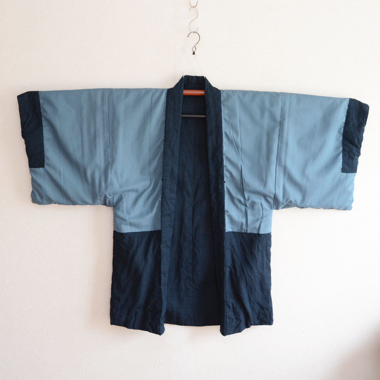 A vintage Japanese clothing item with dragon motif fabric