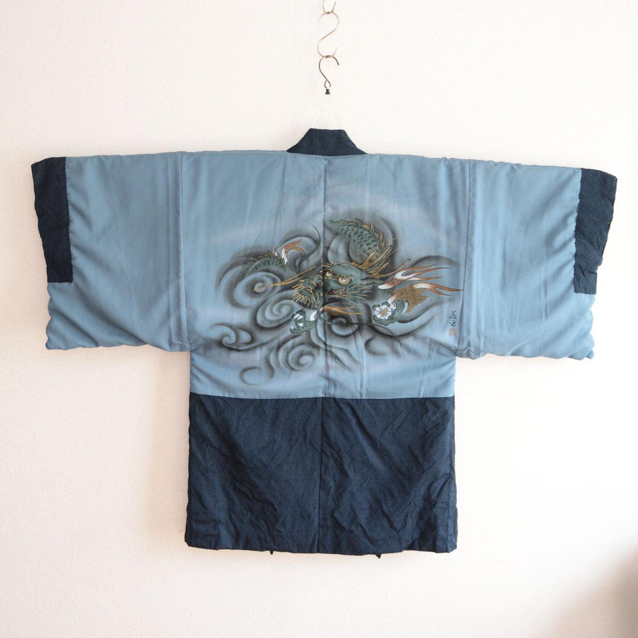 A traditional outer garment from Japan with dragon patterned textile