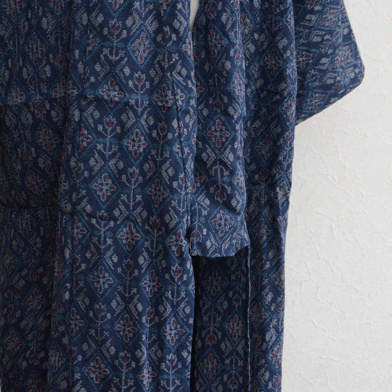 Fold wrinkles visible on the kimono fabric where it had been folded up