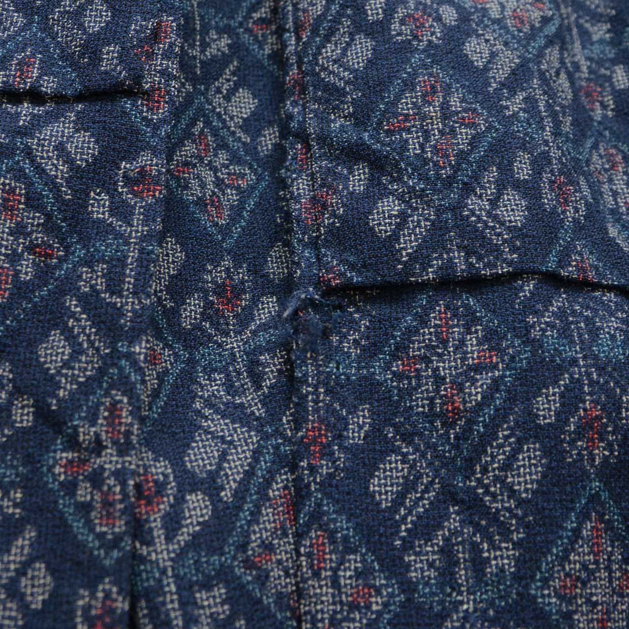 Damaged area on the navy patterned kimono fabric