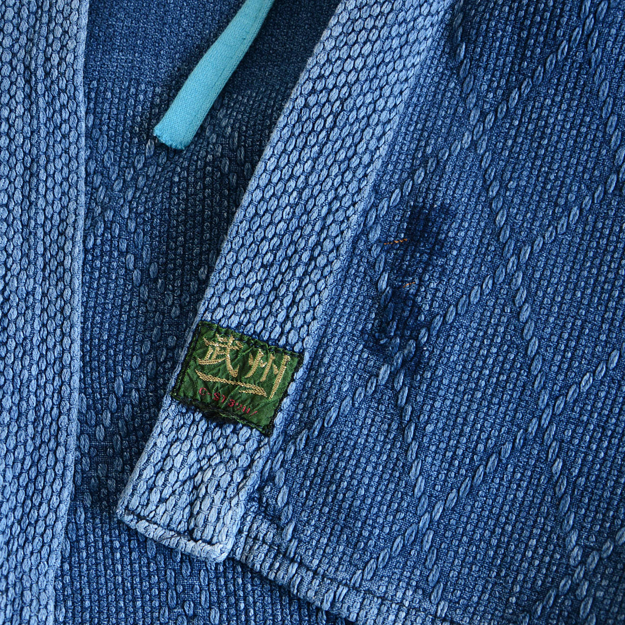 Faded indigo Japanese jacket with charming custom inner pocket