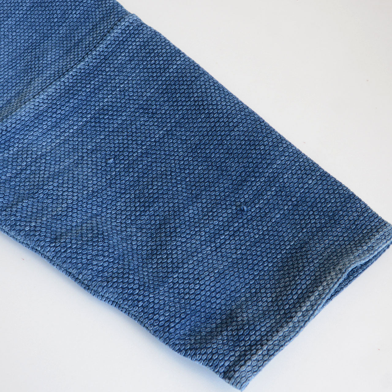 Indigo kendo jacket styled with vintage cloth draped as scarf