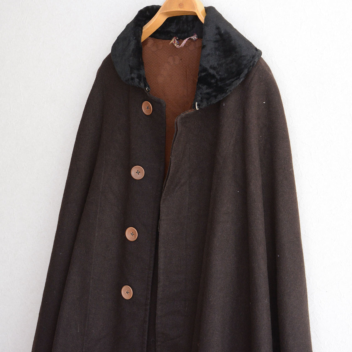 Brown buttons and black collar on a dark brown Japanese vintage mantle