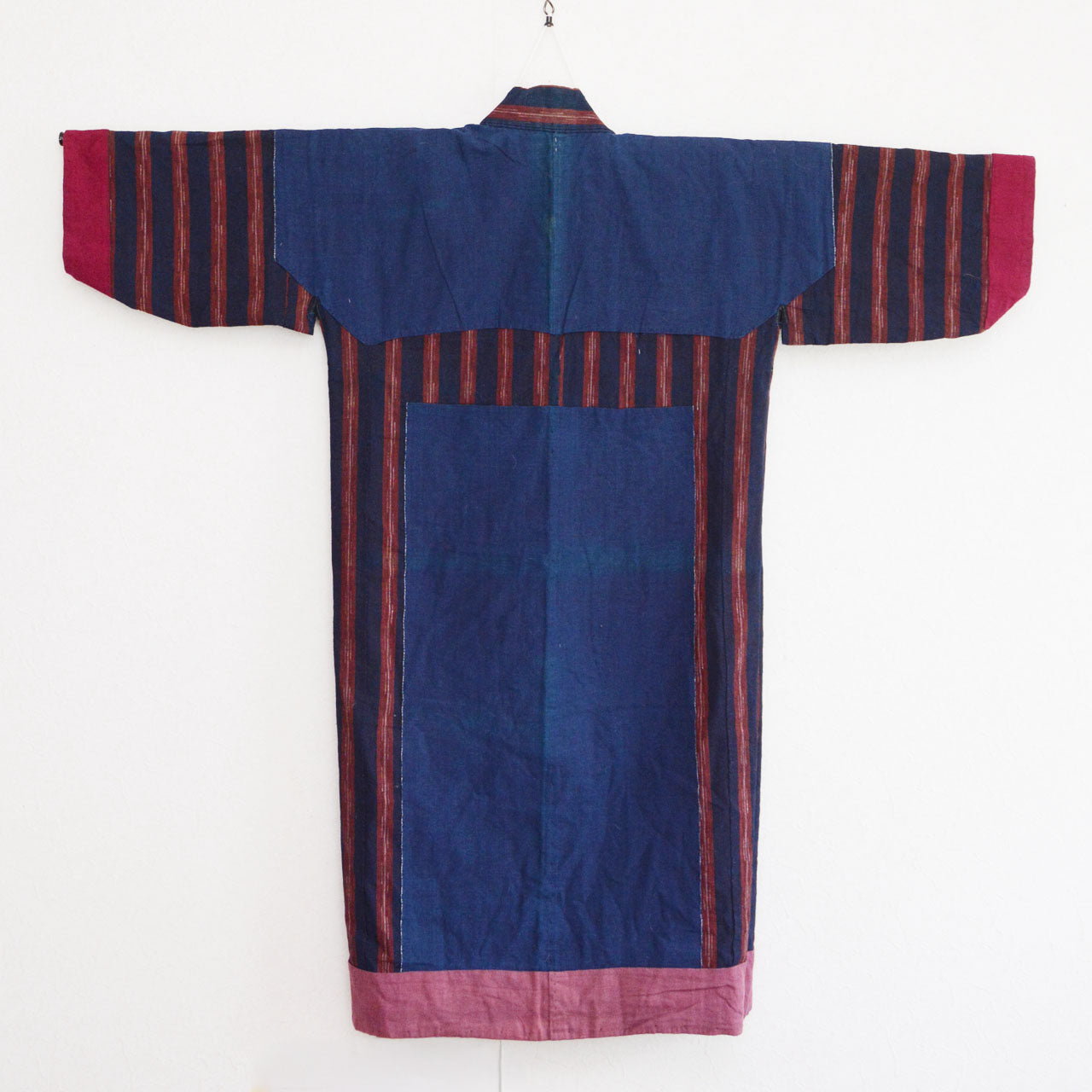 Vintage noragi jacket on hanger, back view of lining — plain indigo cotton, early Showa era, Tohoku