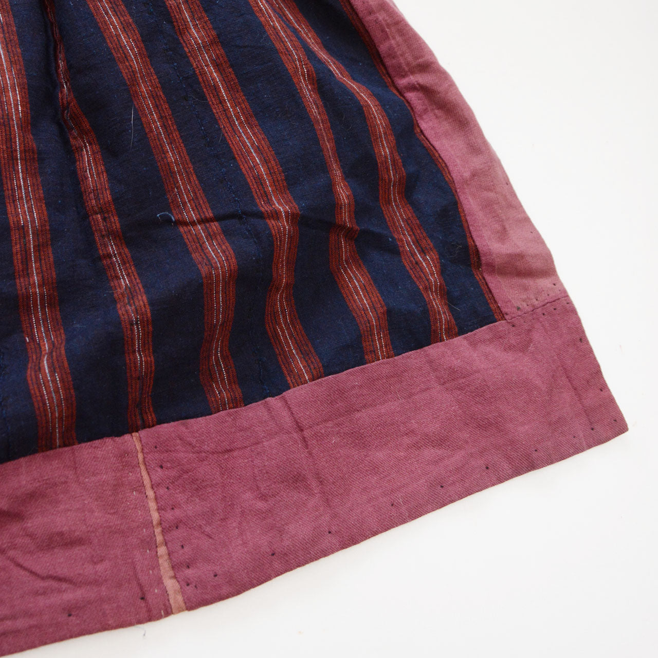Hem lining detail of a vintage noragi — contrasting cotton fabric used on the interior hem, Tohoku, early Showa era