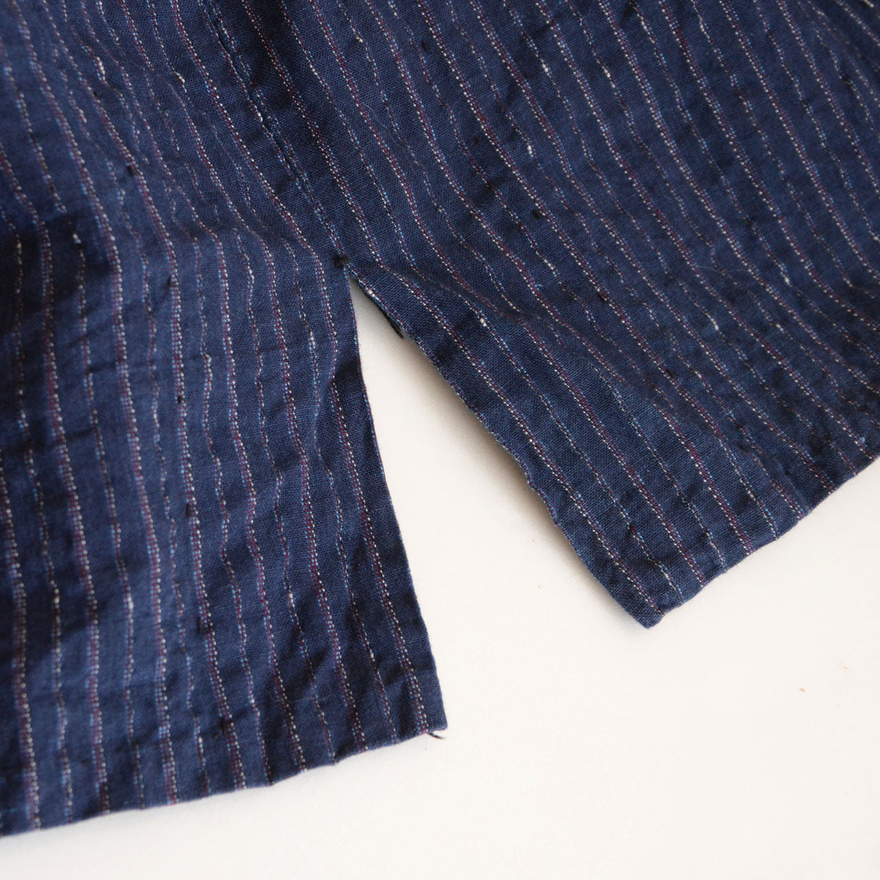 Striped mid-century Japanese folk garment styled for daily wear.