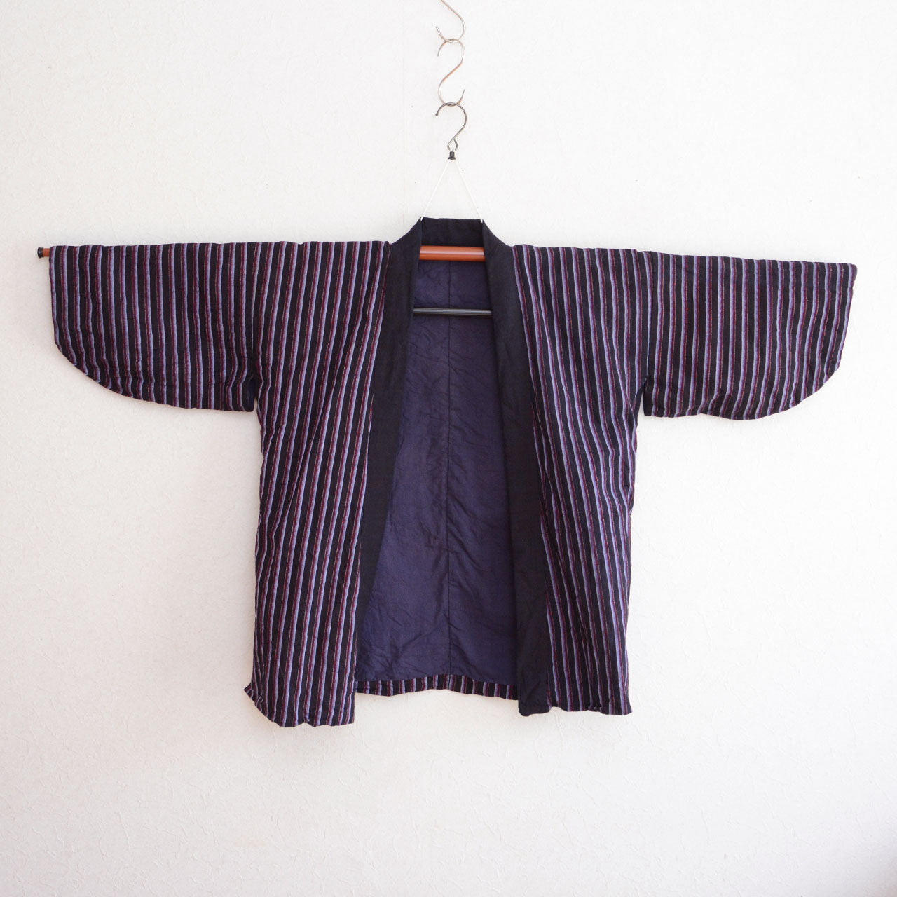 Traditional Japanese workwear noragi with aged cotton textile and stripe pattern